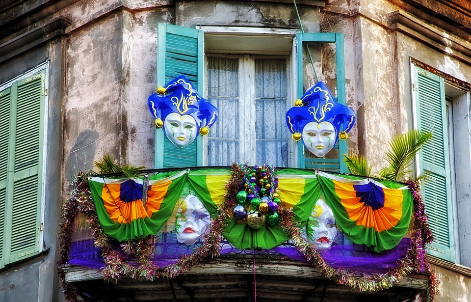 A balcony decked out in Mardi Gras themed masks.