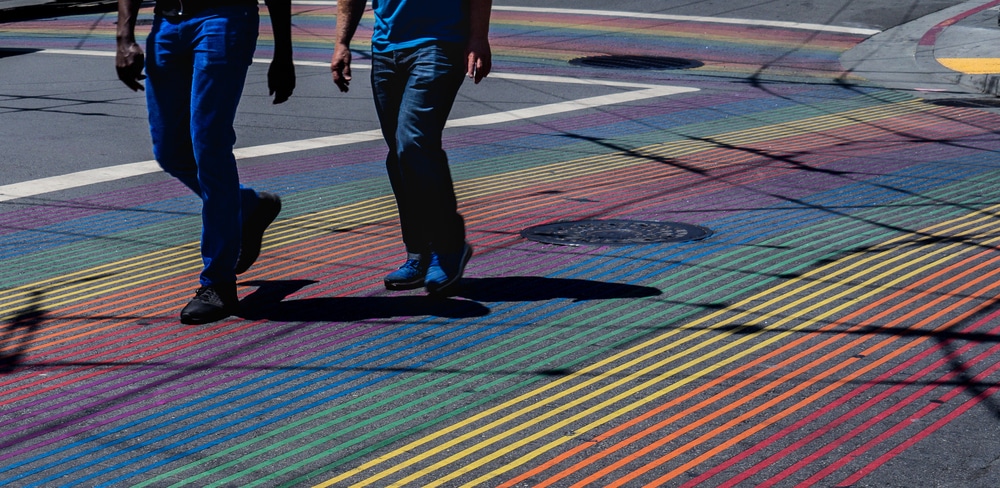 people-crossing-rainbow-crosswalk