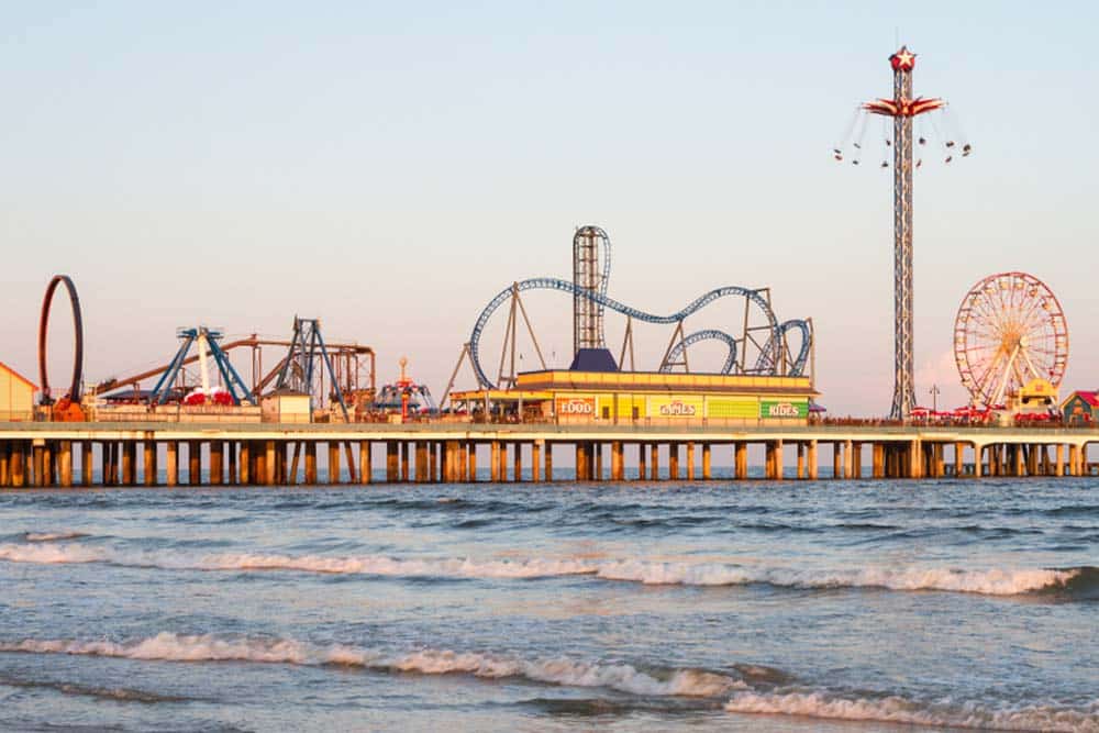 The incredibly fun looking Galveston Texas Pleasure Pier at sunset.