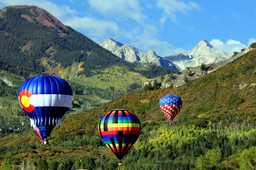 Hot air balloons flying over Snowmass.