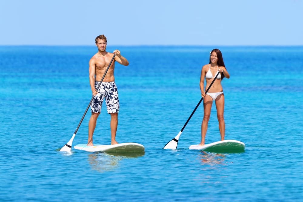 man-and-woman-paddle-boarding